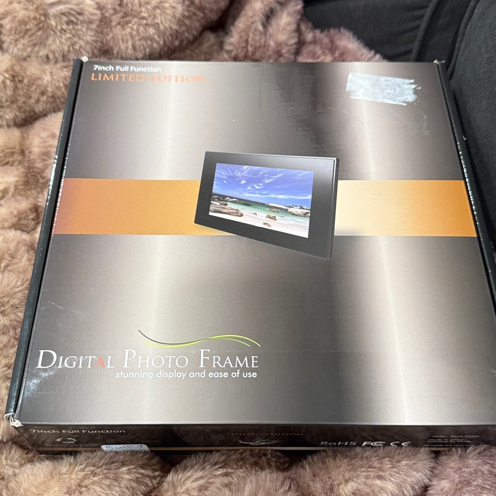 New digital 7” full function black acrylic photo frame with stand -Easy to use.